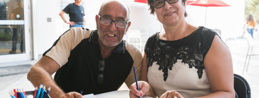 a man and a woman drawing