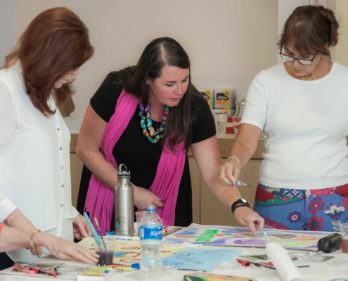 3 ladies doing art work