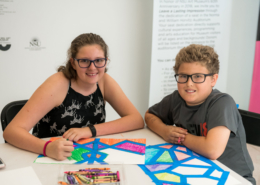 a boy and a girl doing art work