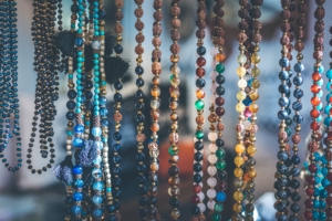 Photo of different colored beads hanging.