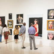 Museum guests looking at artworks