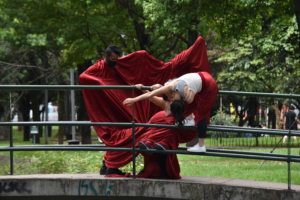 Dancers outside on a bridge
