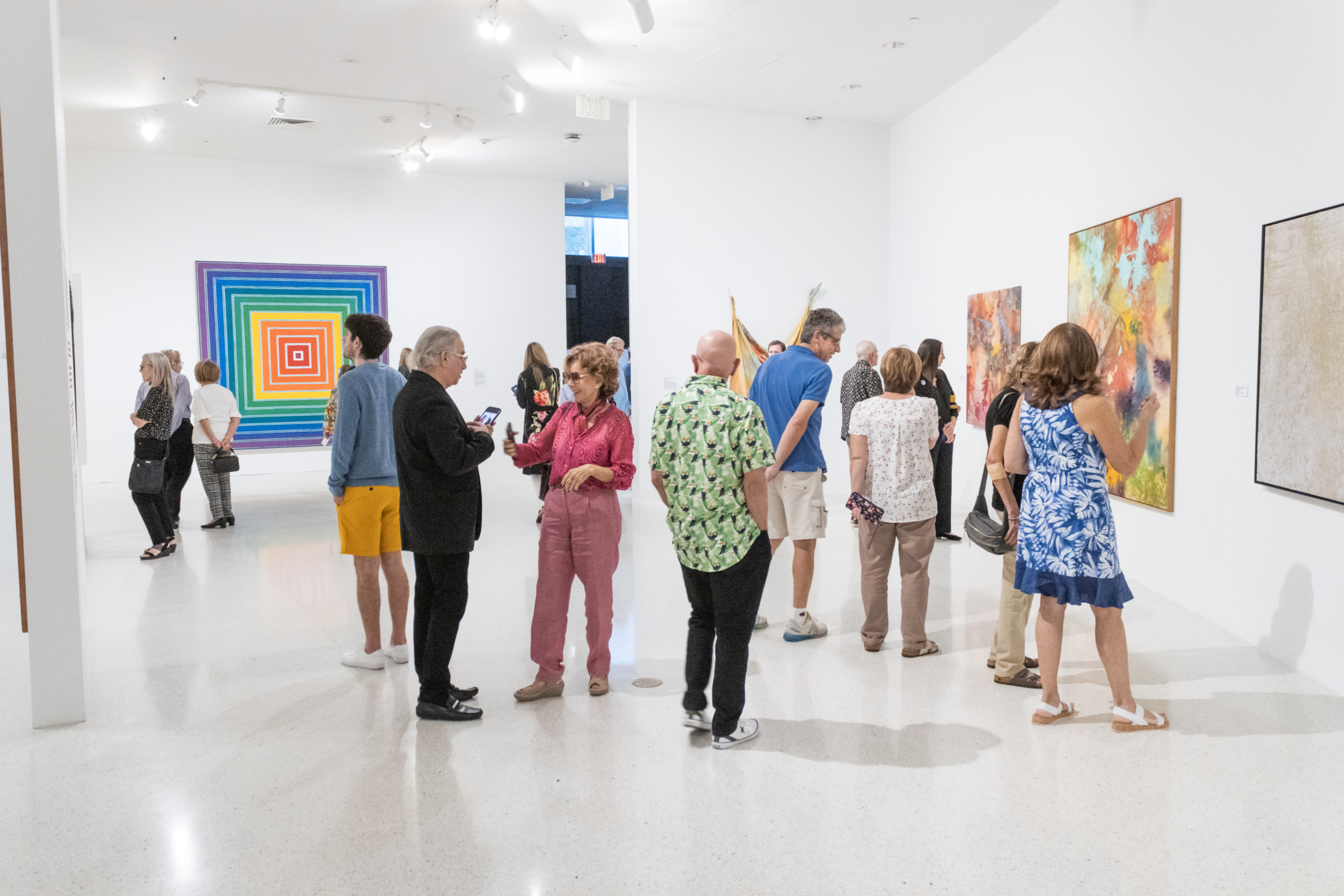 Museum guests looking at art