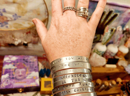 Arm with bracelets and rings