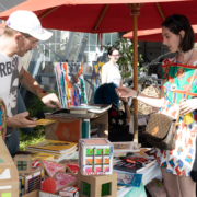 Woman buying art at flea market