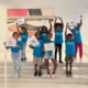 Children holding drawings inside the museum